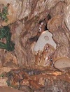 Stone in mouth of cave